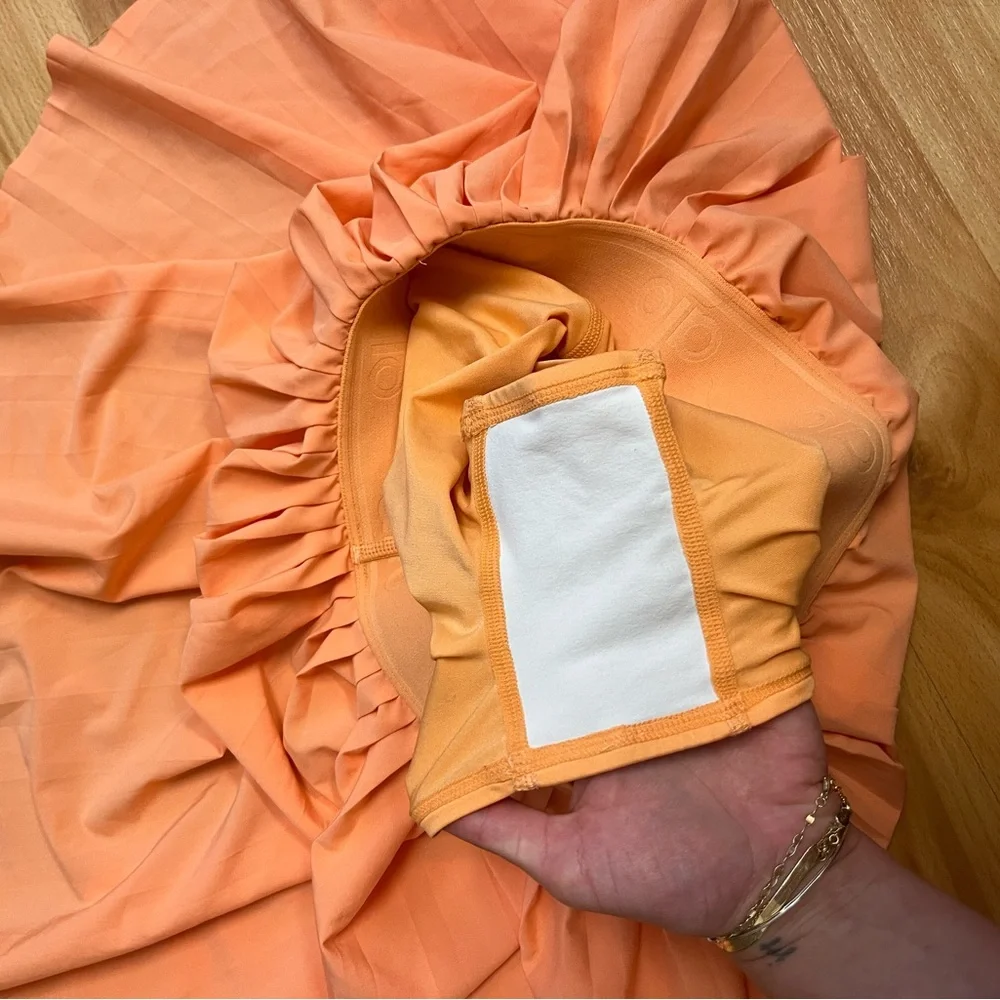 ALO Yoga Orange Pleated Athletic Skirt